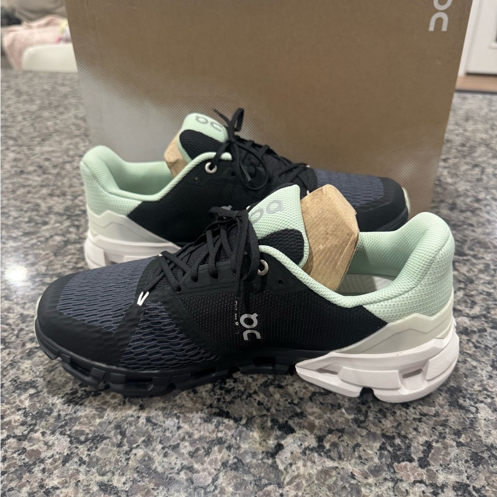 On Running Black and Mint Sneakers